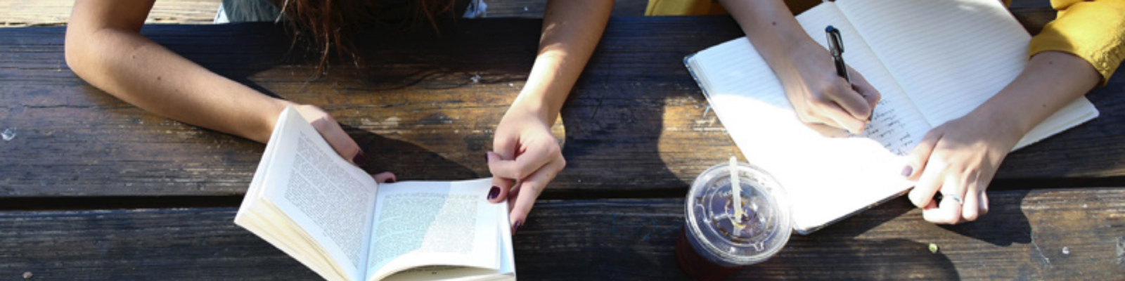 Website development placeholder image of two young woman studying